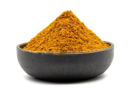 Cajun spice powder isolated on white background. Powdered dried cajun in bowl