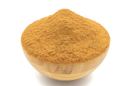 Photo for Cinnamon powder isolated on white background. Powdered dried cinnamon in wooden bowl - Royalty Free Image