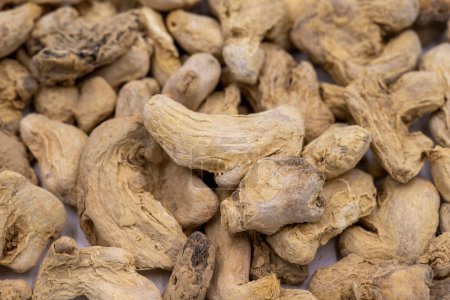 Photo for Pile of Dried Ginger root as background, spice or seasoning as background. Close-up ginger root or Dry Adrak - Royalty Free Image
