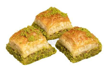 Baklava with pistachios isolated on white background. Turkish cuisine delicacies. Ramadan Dessert. local name kuru baklava