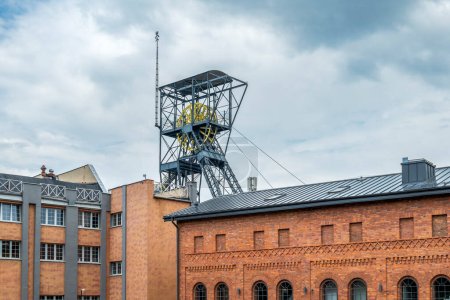 A steel structure of the shaft and a brick post-industrial building. Queen Louise Adit Carnall Zone. Zabrze, Poland