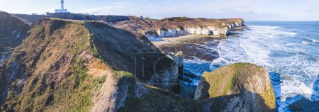 Photo for Panoramic view of Flamborough Head chalk cliffs and the wavy North Sea on a sunny day. High quality photo - Royalty Free Image