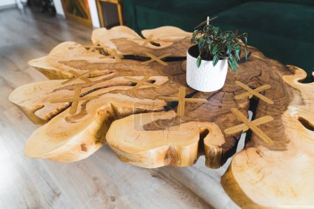 Photo for Closeup shot of a magnificent wooden made decorative table in the living room. High quality photo - Royalty Free Image