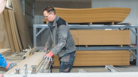 Photo for Senior male carpenter with glasses working at his workshop. High quality photo - Royalty Free Image
