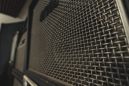 closeup shot of a guitar black amplifier, music studio theme. High quality photo