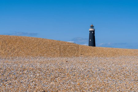 The beach and the Old Lighthouse in Dungeness, Kent, England, UK