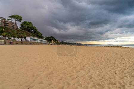 Photo for Branksome Chine Beach, Dorset, England, UK - September 28, 2022:  View from the beach towards Bournemouth with storm approaching - Royalty Free Image