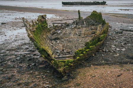 Two shipwrecks on the banks of The Swale near St Giles, Kent, England, UK