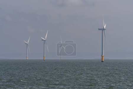 Wind turbines in the Irish Sea near Crosby, Merseyside, England, UK