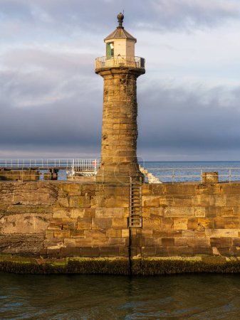 The Whitby Harbour East Pier & Lighthouse in Whitby, North Yorkshire, England, UK