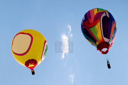 Photo for Two balloons on the background of the blue sky. - Royalty Free Image