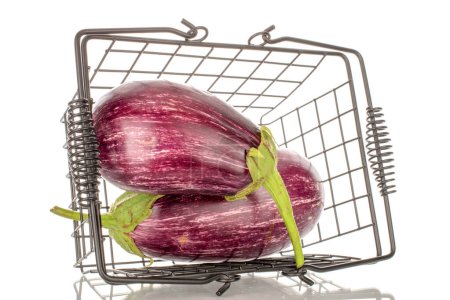 Photo for Two organic ripe eggplants in a basket, macro, isolated on white background. - Royalty Free Image