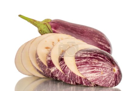 Photo for One juicy eggplant sliced and one whole, macro, isolated on white background. - Royalty Free Image
