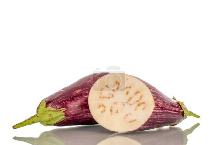 Photo for One whole and one half juicy eggplant, macro, isolated on white background. - Royalty Free Image