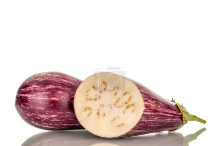 Photo for One whole and one half juicy eggplant, macro, isolated on white background. - Royalty Free Image