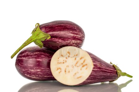Photo for Two whole and one half juicy eggplant, macro, isolated on white background. - Royalty Free Image