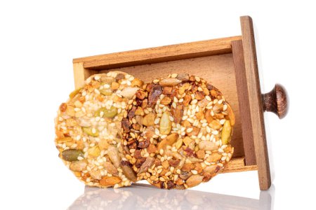 Two sweet Italian cookies with nuts in a wooden box, macro, isolated on white background.
