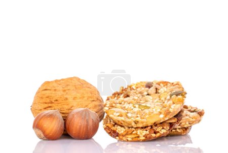 Several sweet Thaler cookies with nuts, macro, isolated on white background.