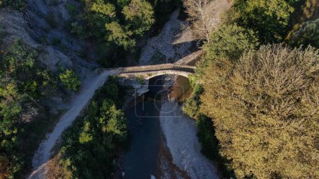 Photo for Old stone bridge Kaber Aga, Zagoritikos river, aerial view, Zagori, Epirus, Greece - Royalty Free Image