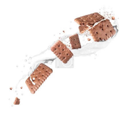 Foto de Delicious biscuits with chocolate flavor in milk splashes in the air - Imagen libre de derechos
