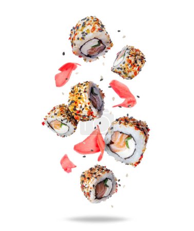 Foto de Rollos de sushi fresco con jengibre en el aire aislado sobre fondo blanco - Imagen libre de derechos