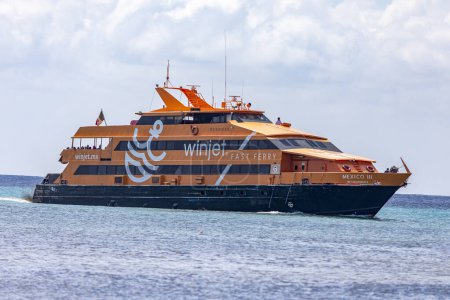 Photo for Playa del Carmen, Mexico; March 15, 2023: fast ferry from Playa del Carmen to Cozumel in Mexico with the winjet shipping line, the most used transport for this leg of the trip. - Royalty Free Image