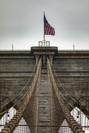 Vertical photograph of the Brooklyn Bridge linking the boroughs of Manhattan and Brooklyn in New York City (USA). It was the largest suspension bridge in the world, record span until 1889.