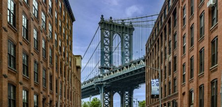 Photo for New York, USA; June 3, 2023: Wonderful day in Dumbo, the trendy Brooklyn neighborhood with picturesque views of the Manhattan skyline and bridge, a popular tourist attraction. - Royalty Free Image