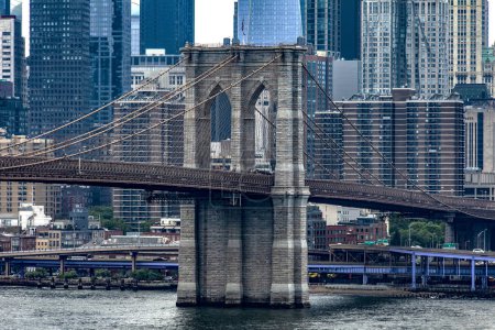 Photo for The famous Brooklyn Bridge linking the boroughs of Manhattan and Brooklyn in New York City (USA), this bridge is one of the most famous and well known in the Big Apple. - Royalty Free Image