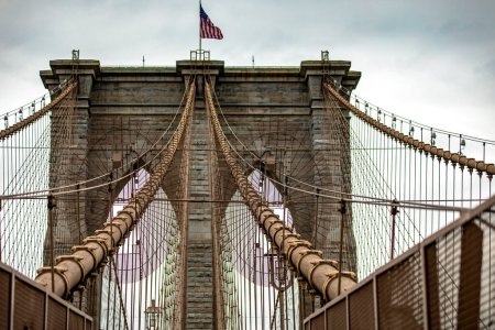 Photo for The incredible Brooklyn Bridge linking the boroughs of Manhattan and Brooklyn in New York City (USA), the largest suspension bridge in the world until 1889. - Royalty Free Image