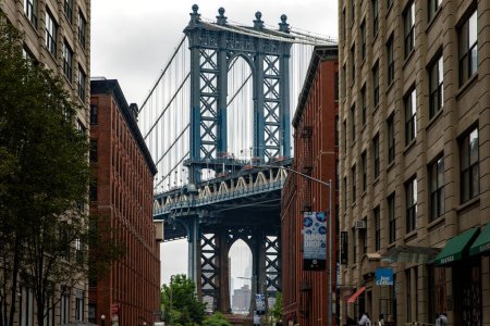 Photo for New York, USA; June 3, 2023: Dumbo the trendy Brooklyn neighborhood with picturesque views of the Manhattan skyline and bridge. - Royalty Free Image