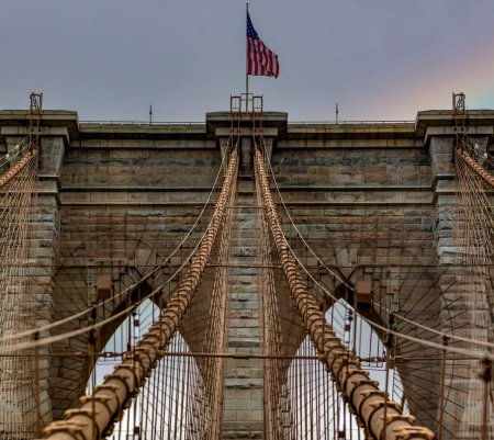 Photo for Wonderful panoramic view of the Brooklyn Bridge linking the boroughs of Manhattan and Brooklyn in New York City (USA). It was the largest suspension bridge in the world, record span until 1889. - Royalty Free Image