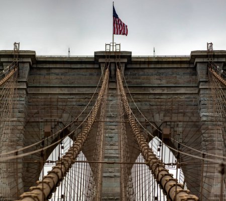 Photo for Spectacular panorama of the Brooklyn Bridge linking the boroughs of Manhattan and Brooklyn in New York City (USA). It was the largest suspension bridge in the world, record span until 1889. - Royalty Free Image