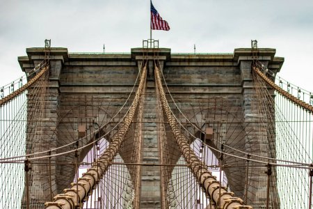 Photo for Panoramic view of the incredible Brooklyn Suspension Bridge linking the boroughs of Manhattan and Brooklyn in New York City (USA), the largest suspension bridge in the world until 1889. - Royalty Free Image