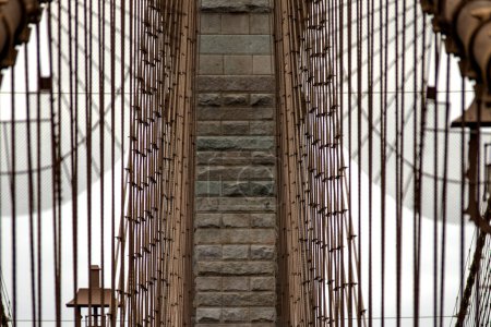 Photo for Central cables of the Brooklyn Suspension Bridge linking the boroughs of Manhattan and Brooklyn in New York City (USA), the largest suspension bridge in the world until 1889. - Royalty Free Image