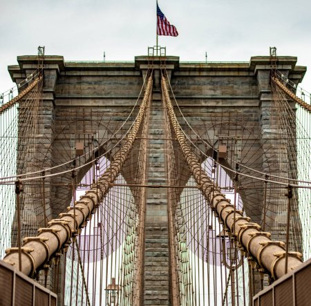 Photo for The incredible Brooklyn Suspension Bridge linking the boroughs of Manhattan and Brooklyn in New York City (USA), the largest suspension bridge in the world until 1889. - Royalty Free Image