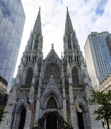 Vertical photo of St. Patrick's catholic cathedral of neo-gothic decorated style, located in midtown Manhattan on the fifth avenue of the Big Apple in the heart of New York (USA).
