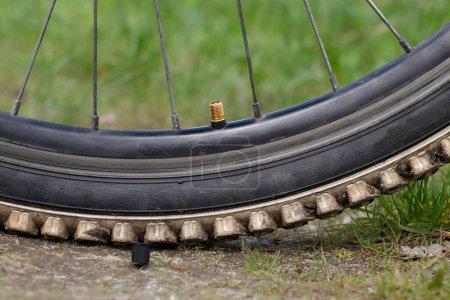 Photo for Bicycle wheel inflation.Bicycle wheel close-up.Open valve cap on the wheel. - Royalty Free Image