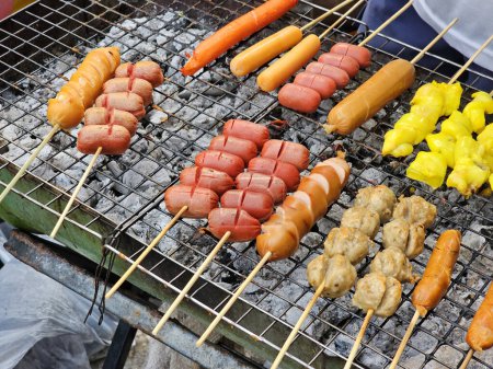 Sausage on skewers grilled over charcoal in Thai style.