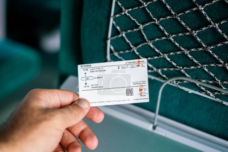Photo for A man holding a railway ticket inside a high speed train in Morocco - Royalty Free Image