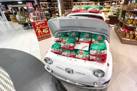 Téléchargez les photos : BONIFANTI products wrapped and put in the front trunk of a decorative car at Malpensa airport in Milan, Italy - en image libre de droit