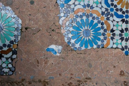Photo for An aged mosaic tiled floor at Cherratine Madrasa in the old medina of Fez, Morocco - Royalty Free Image