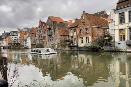Photo for City tour boat sailing on the canal in Ghent, Belgium - Royalty Free Image