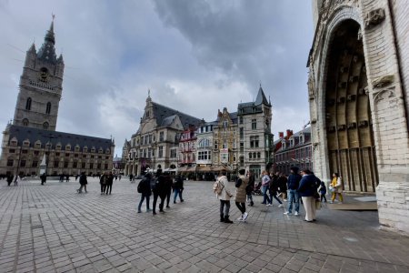 Photo for Tourists walking at Sint-Baafsplein square in Ghent, Belgium - Royalty Free Image