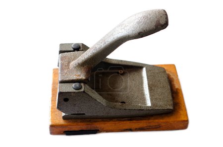 Photo for Old vintage iron paper hole puncher isolated on white background. Concept, office tool, equipment to  make hole of paper document before arranging or keeping into binders file. - Royalty Free Image
