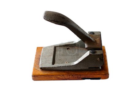 Photo for Old vintage iron paper hole puncher isolated on white background. Concept, office tool, equipment to make hole of paper document before arranging or keeping into binders file. - Royalty Free Image