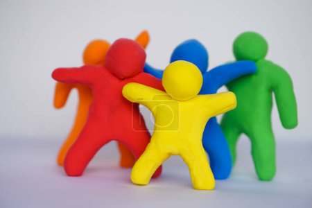 Photo for Colorful plasticine people. Human figures from plasticine sculpture. Concept, friendships, partnerships and relationships between people. Sculting enhance imagination. - Royalty Free Image