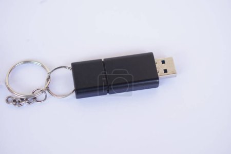 Photo for USB memory stick with information storage, on white background. Small, portable device that plugs into USB port on computer to data backup, storage or transfer files between devices. - Royalty Free Image