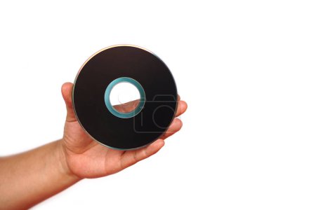 Photo for Close up hand hold CD compact disc, DVD, isolated on white background. Concept, tool, equipment for setup or install programs in computer or music, movie for dvd player. - Royalty Free Image