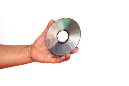 Photo for Close up hand hold CD compact disc, DVD, isolated on white background. Concept, tool, equipment for setup or install programs in computer or music, movie for dvd player. - Royalty Free Image